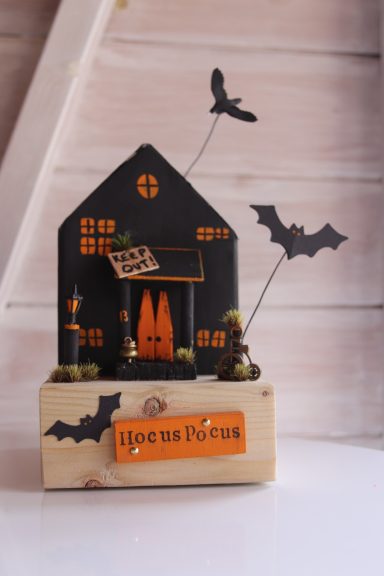 Hocus Pocus Haunting Halloween decoration featuring a haunted house, bats, and spooky trees.